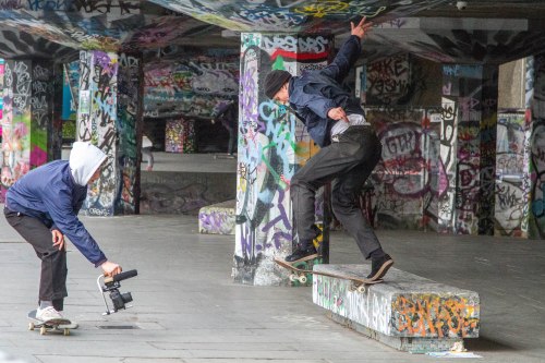 Skater and filmer nailing clips in the South Bank in London
